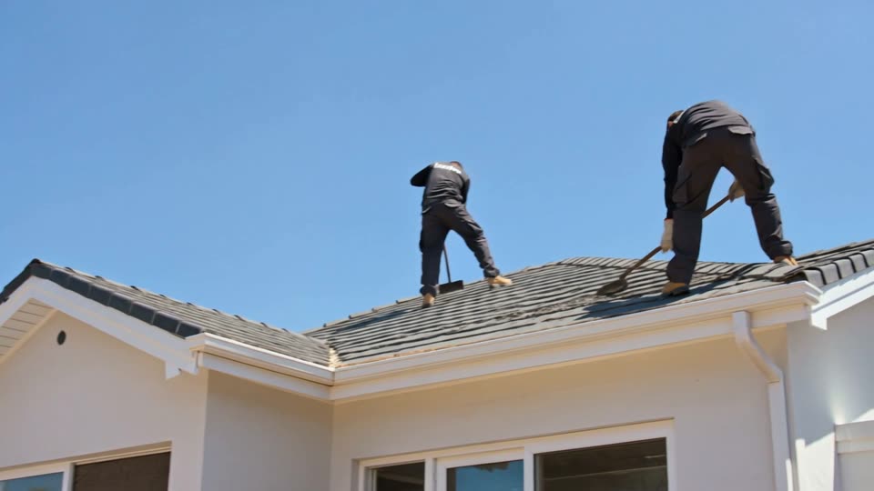 Asbestos Removal Cape Town - contractors stripping asbestos cement roof sheets from a house roof